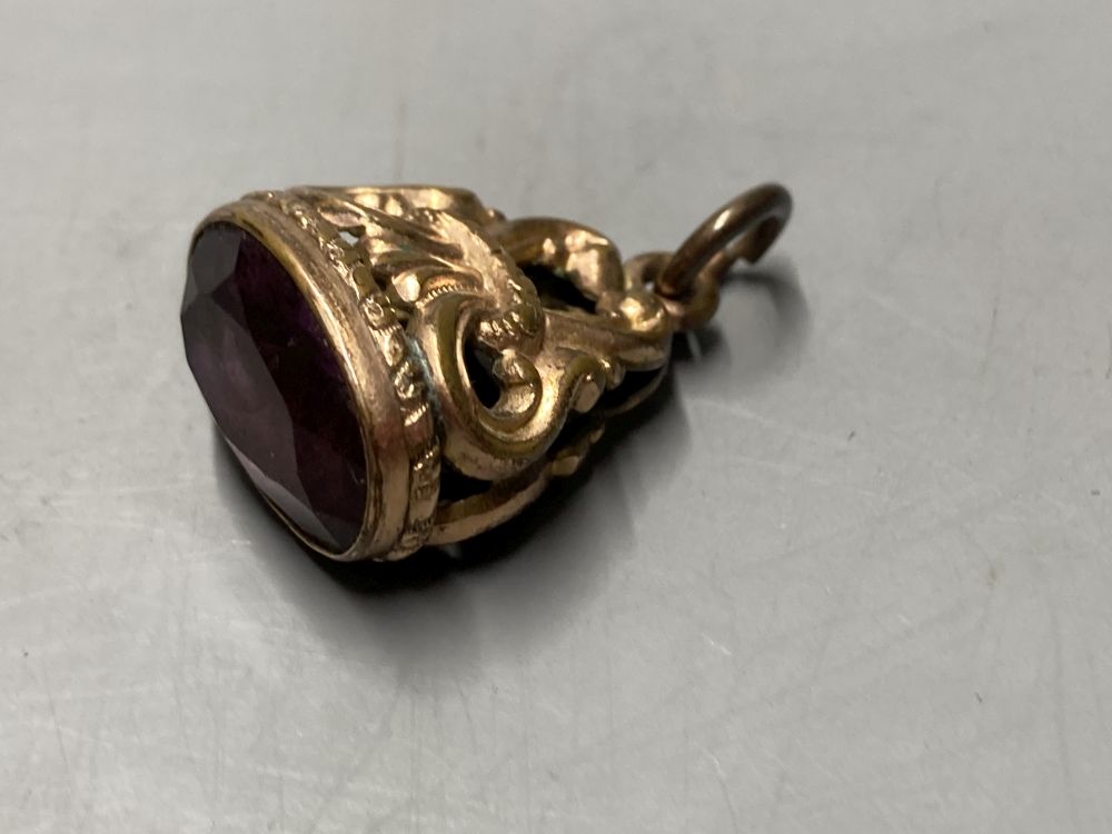 Two gold plated overlaid and gem set fob seals, largest 35mm, a 9ct front and back locket and a scroll brooch.